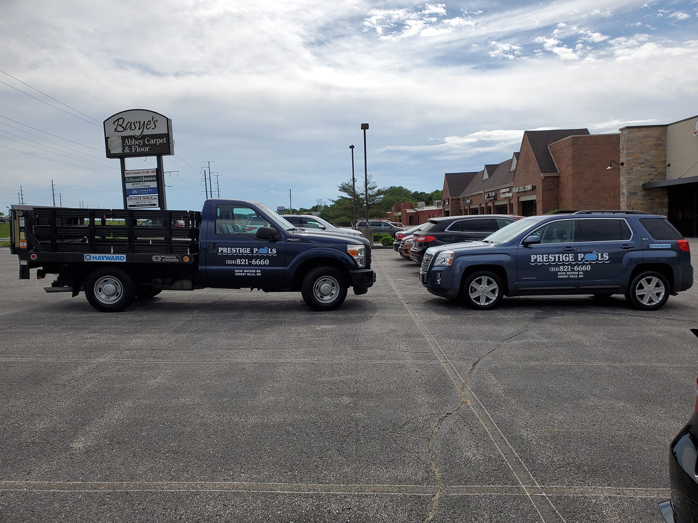 Prestige Pool service fleet vehicles with matching graphics
